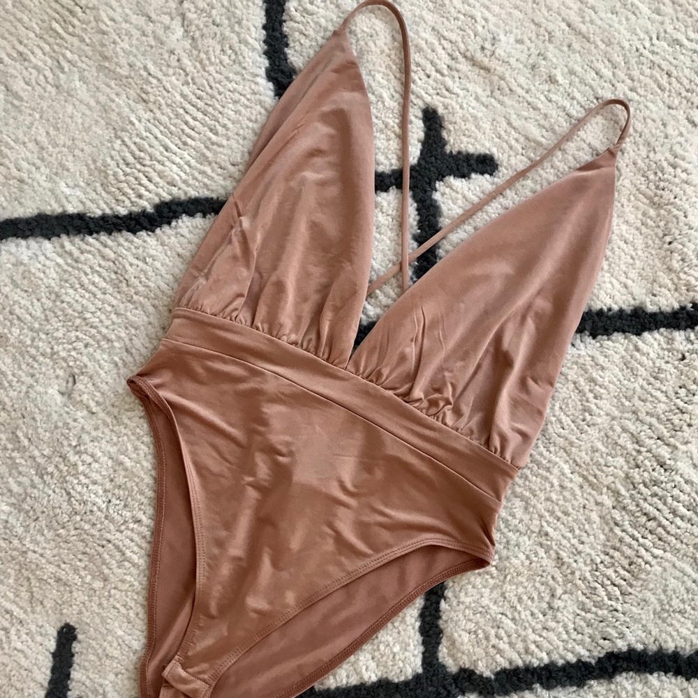 Strappy, low-cut bodysuit!